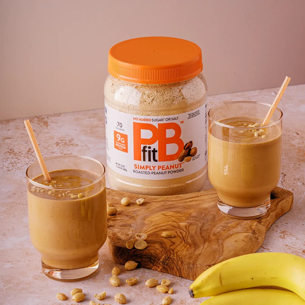 Chocolate peanut butter smoothie next to PBfit simply peanut