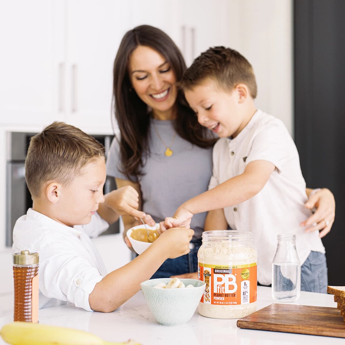 Family preparing food in kitchen